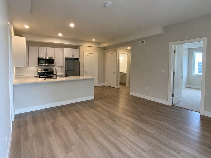 Apartment unit kitchen and living area with freshly painted walls