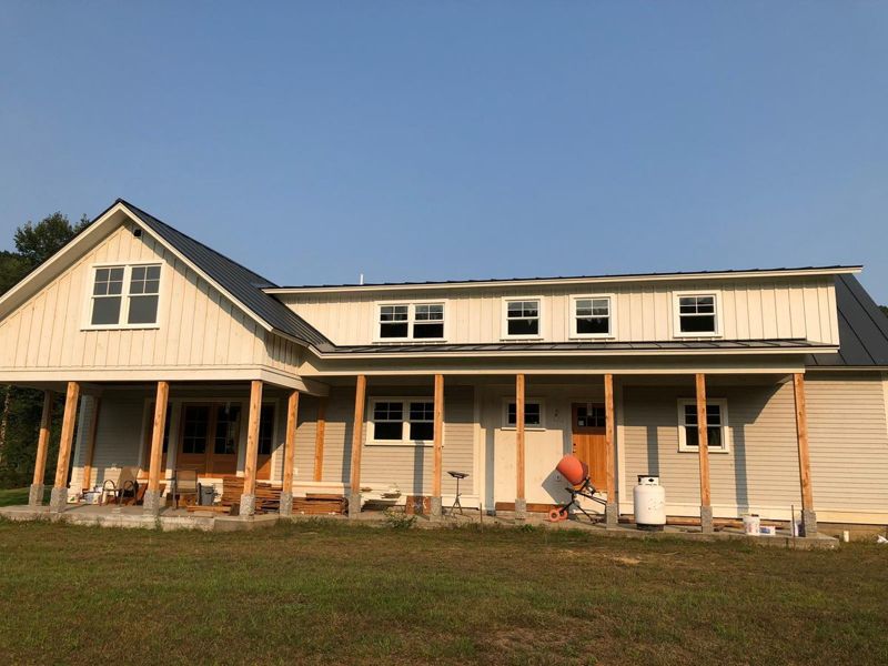 Farmhouse exterior before repainting (Before)