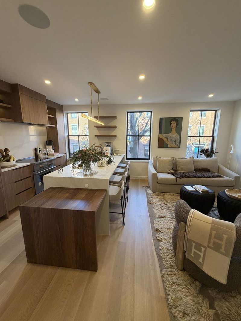 Open kitchen and living room with freshly painted walls and ceiling